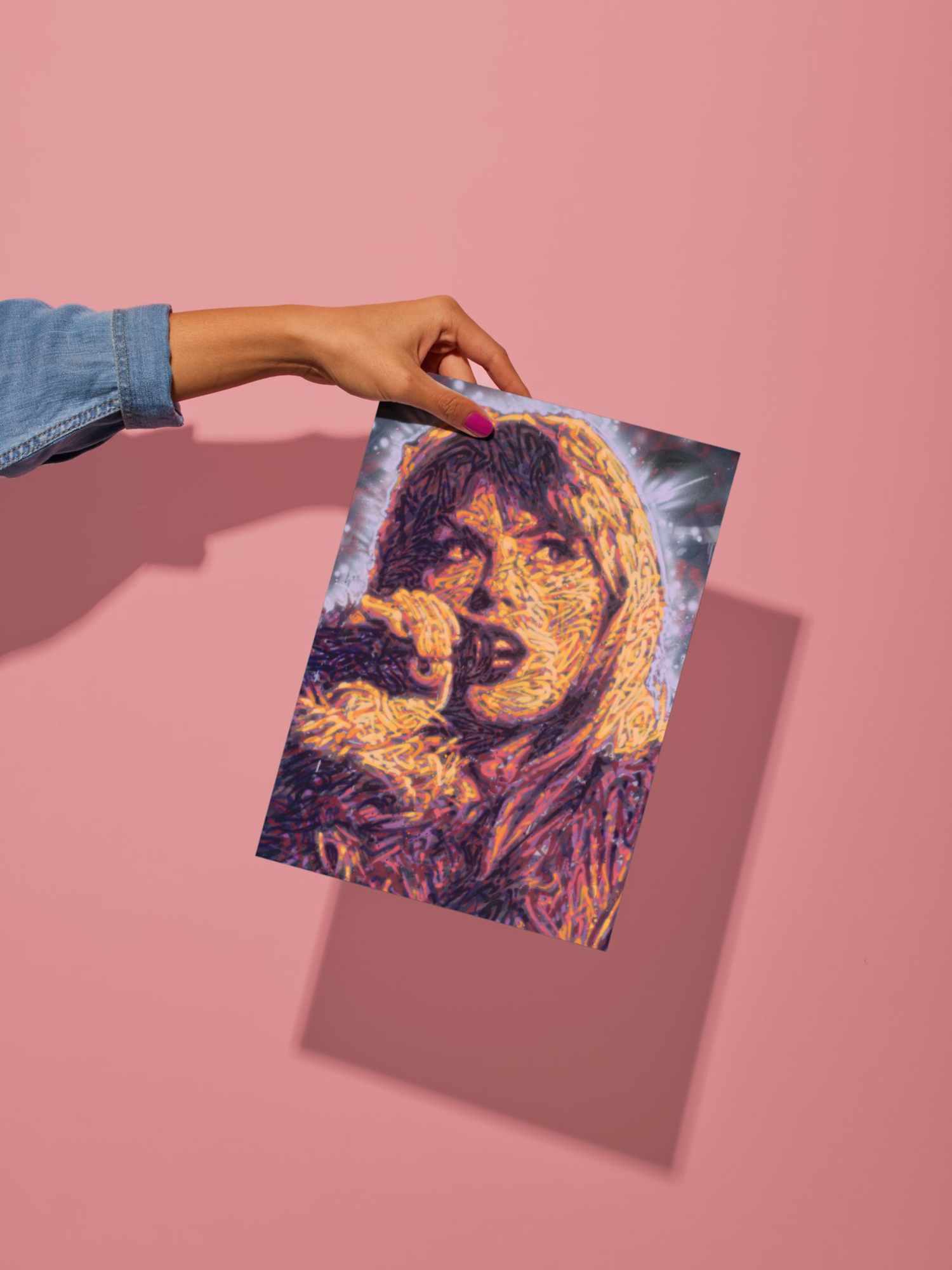 Mockup of a graffiti spray can portrait by Ben Jay of Blank Space Removal of Taylor Swift holding a microphone, behind held by a woman's hand in front of a pink wall to show size and shadow.